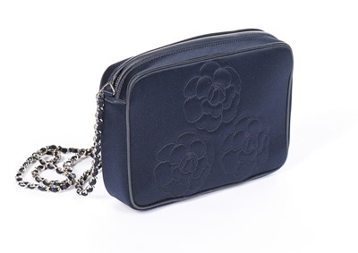 Lot 124 - A Chanel navy satin shoulder bag, 1990s,...