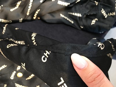 Lot 238 - A Chanel by Karl Lagerfeld printed silk blouse and matching gilt cufflinks, circa 1988