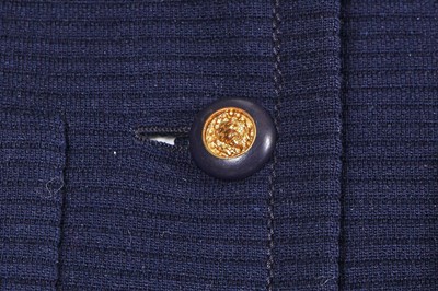 Lot 58 - A Chanel haute couture navy blue jersey suit, circa 1973