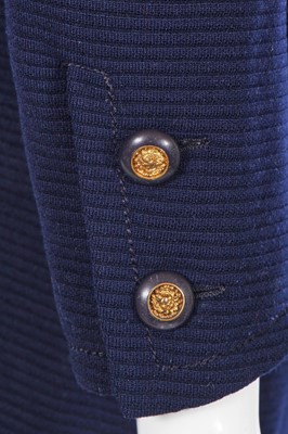 Lot 58 - A Chanel haute couture navy blue jersey suit, circa 1973
