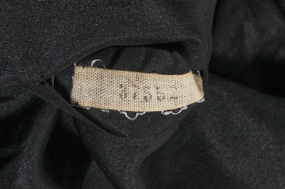 Lot 60 - A Gabrielle Chanel haute couture black wool and silk ensemble, circa 1969