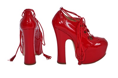 Lot 179 - A pair of Vivienne Westwood red patent leather elevated ghillie heels, 2000s