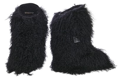 Lot 104 - A pair of Saint Laurent by Anthony Vaccarello black Mongolian sheepskin fur boots, circa 2019