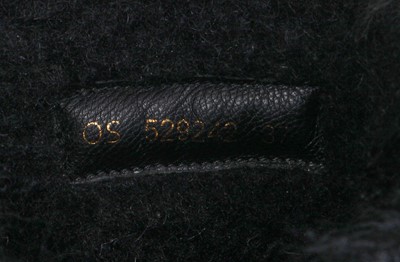 Lot 104 - A pair of Saint Laurent by Anthony Vaccarello black Mongolian sheepskin fur boots, circa 2019