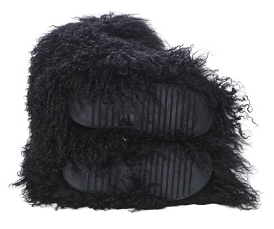 Lot 104 - A pair of Saint Laurent by Anthony Vaccarello black Mongolian sheepskin fur boots, circa 2019