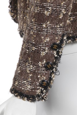 Lot 24 - A Chanel by Karl Lagerfeld grey and gold tweed jacket, late 1990s