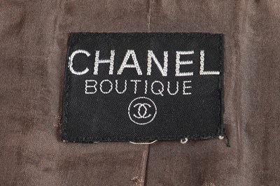 Lot 24 - A Chanel by Karl Lagerfeld grey and gold tweed jacket, late 1990s