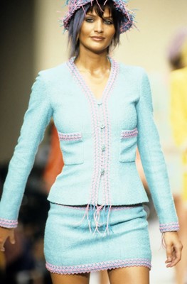 Lot 34 - A Chanel by Karl Lagerfeld turquoise cotton-wool blend bouclé suit, 'The New Corset' collection, Spring-Summer 1994