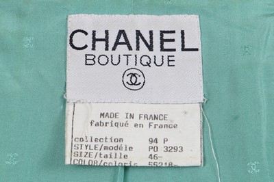 Lot 34 - A Chanel by Karl Lagerfeld turquoise cotton-wool blend bouclé suit, 'The New Corset' collection, Spring-Summer 1994