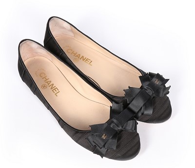 Lot 128 - A pair of Chanel black satin ballet pumps,...