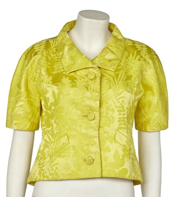 Lot 630 - An Hubert de Givenchy haute couture bright yellow damask satin jacket, circa 1963