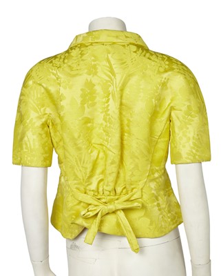 Lot 630 - An Hubert de Givenchy haute couture bright yellow damask satin jacket, circa 1963