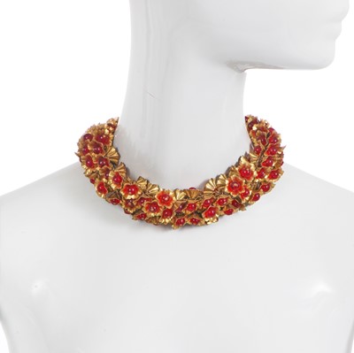 Lot 511 - An Elsa Schiaparelli brass and glass necklace, 1940s