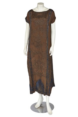 Lot 672 - A beaded brown silk evening dress, circa 1920