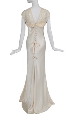 Lot 169 - A John Galliano ivory crêpe evening gown, 'Welcome to our Playground' collection, Autumn-Winter 2000-01