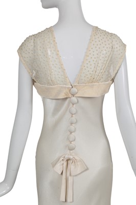 Lot 169 - A John Galliano ivory crêpe evening gown, 'Welcome to our Playground' collection, Autumn-Winter 2000-01