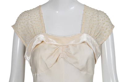 Lot 169 - A John Galliano ivory crêpe evening gown, 'Welcome to our Playground' collection, Autumn-Winter 2000-01