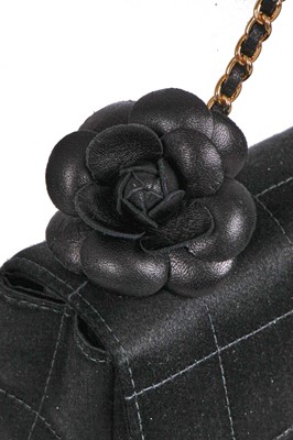 Lot 25 - A Chanel by Karl Lagerfeld black silk mini camellia classic flap shoulder bag, 2003-04