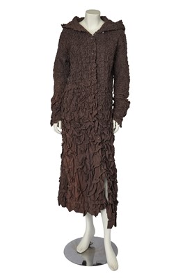 Lot 448 - An Issey Miyake by Naoki Takizawa textured brown cotton dress-coat, Autumn-Winter 2001-02