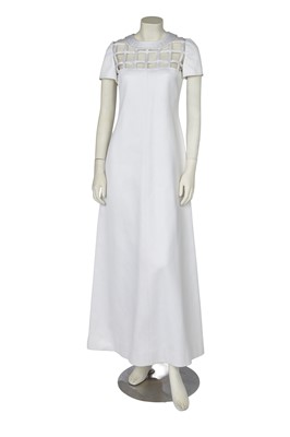 Lot 591 - An André Courrèges white satinised cotton maxi dress, 1970s