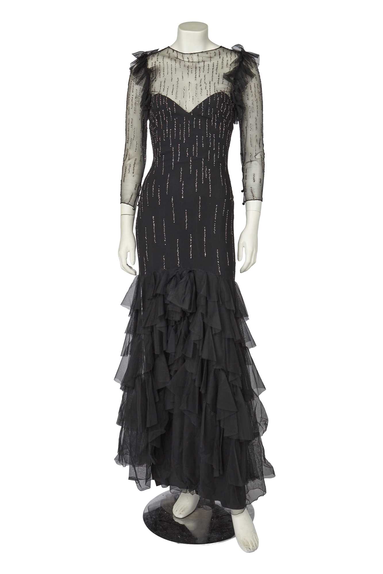 Lot 532 - A Loris Azzaro irridescent sequined black tulle evening gown, late 1970s
