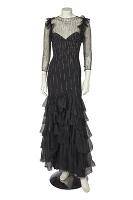 Lot 532 - A Loris Azzaro irridescent sequined black tulle evening gown, late 1970s