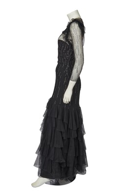 Lot 532 - A Loris Azzaro irridescent sequined black tulle evening gown, late 1970s