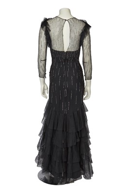 Lot 532 - A Loris Azzaro irridescent sequined black tulle evening gown, late 1970s