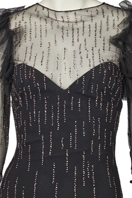 Lot 532 - A Loris Azzaro irridescent sequined black tulle evening gown, late 1970s