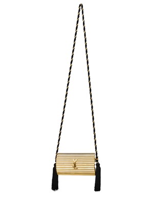 Lot 502 - An Yves Saint Laurent gilt resin cylindrical minaudière, 1980s
