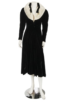 Lot 675 - A Victor Stiebel black velvet and white fur coat, late 1930s