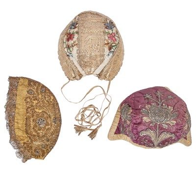 Lot 746 - Three embroidered caps, European 18th century