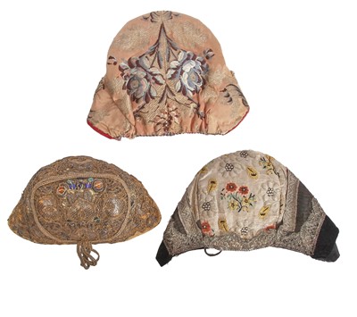 Lot 738 - Three regional bonnets, probably French, 19th century