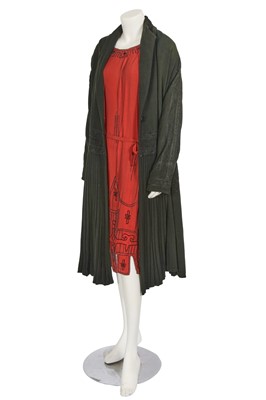 Lot 705 - An embroidered black wool coat, early 1920s