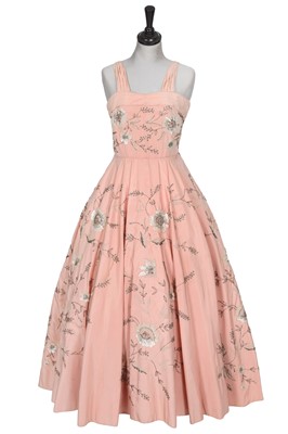 Lot 660 - A Paquin/Worth embellished pink faille ballgown, circa 1955