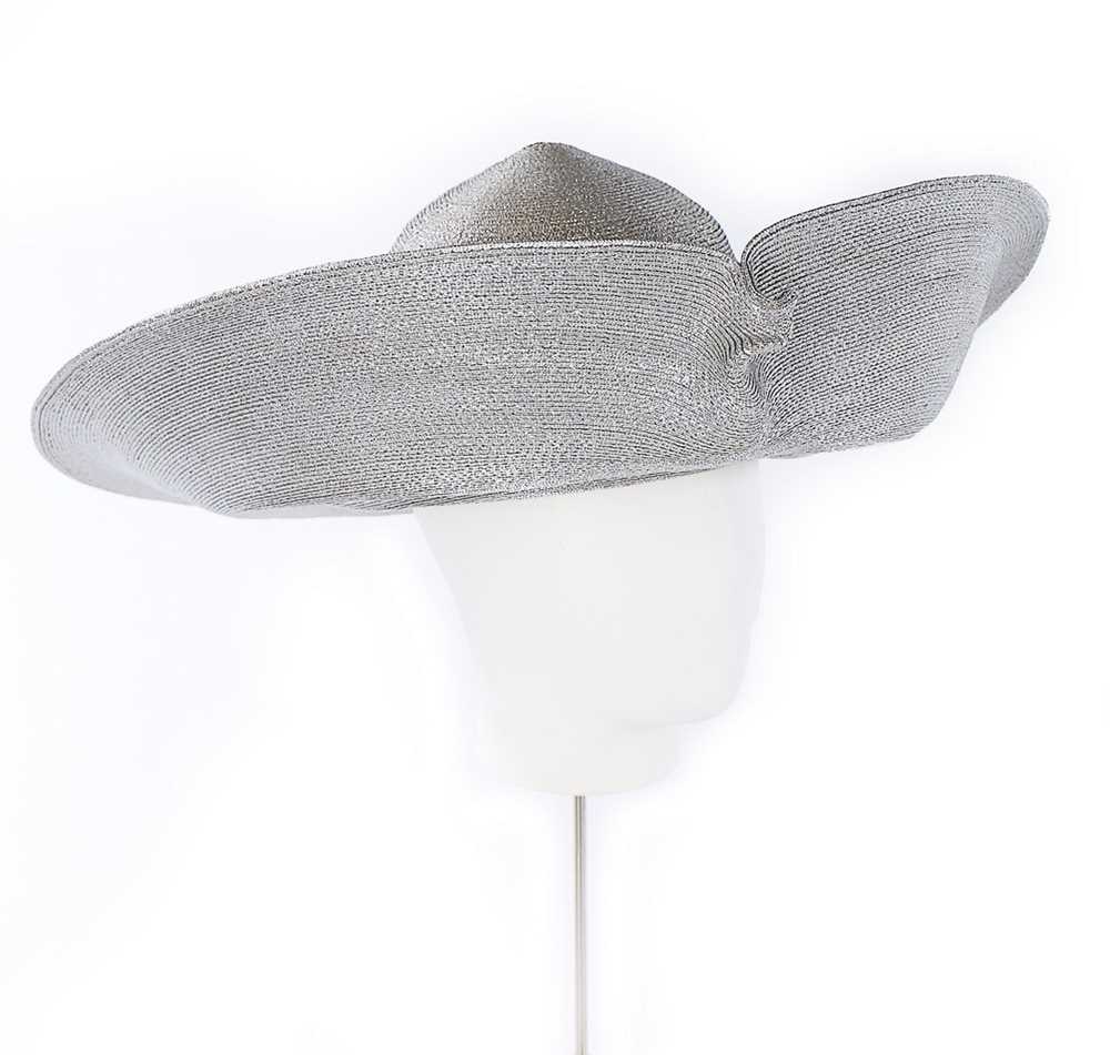 Lot 68 - A Philip Treacy wide-brimmed silver straw hat,...
