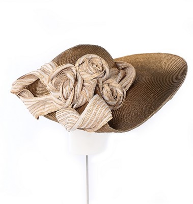 Lot 68 - A Philip Treacy wide-brimmed silver straw hat,...