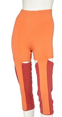 Lot 444 - A pair of Issey Miyake red and orange cotton blend cut-out trousers, Spring-Summer 1991