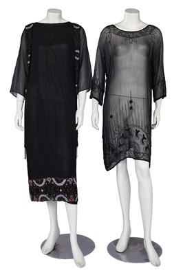 Lot 699 - Two beaded black silk dresses, early 1920s