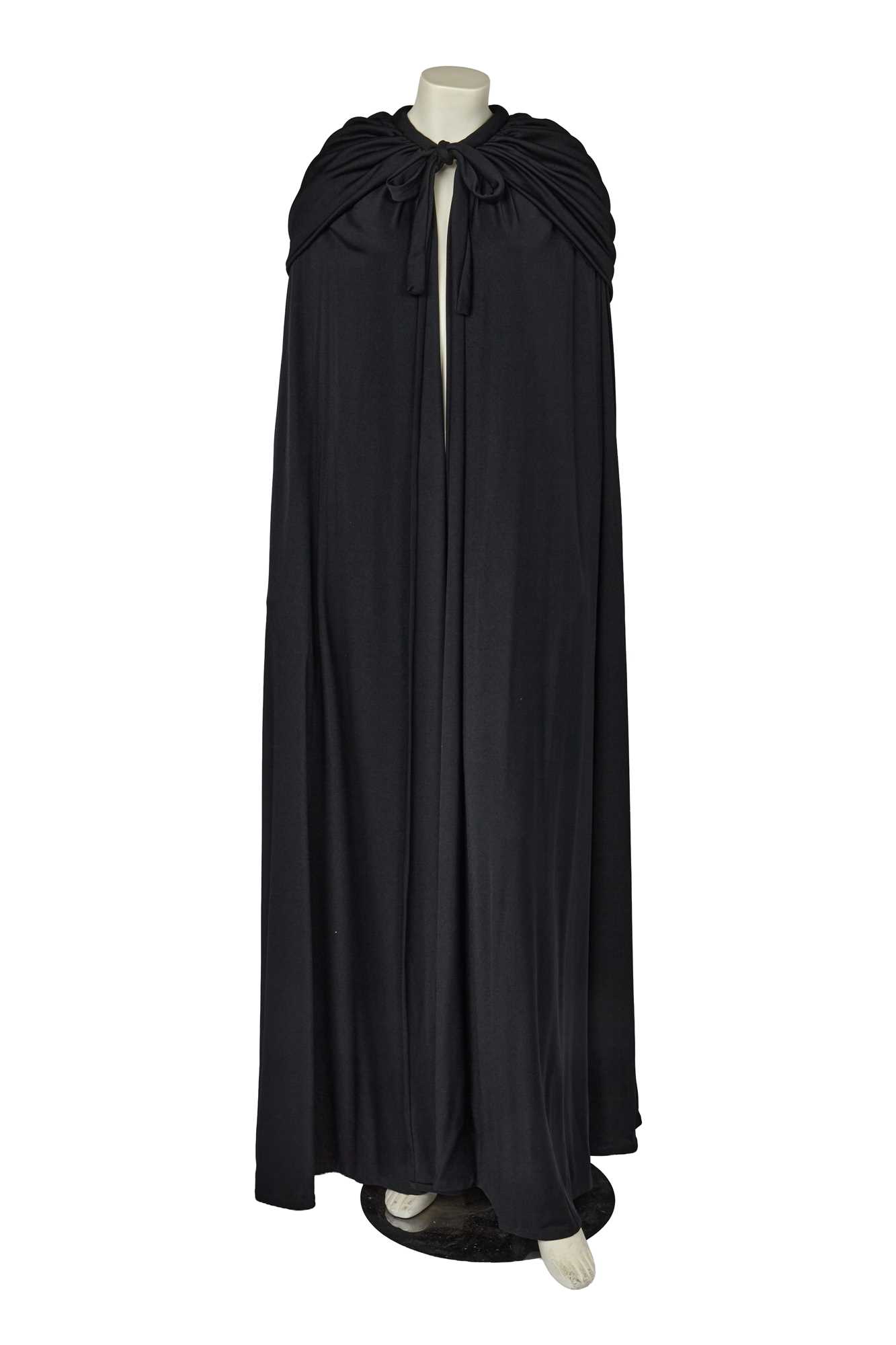 Lot 609 - A Loris Azzaro black jersey evening cape, 1970s