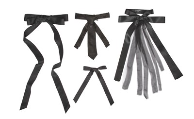 Lot 8 - A group of Chanel by Karl Lagerfeld black ribbon ties and brooches, 2010s