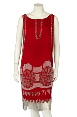 Lot 689 - A beaded orange chiffon flapper dress, circa 1925