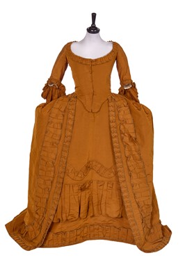Lot 533 - A ginger silk gros de Tours robe à la française, 1760s, altered 1770s