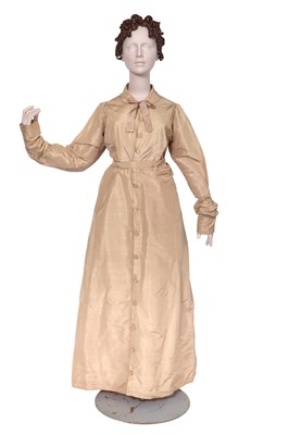 Lot 525 - A beige silk taffeta pelisse, circa 1810