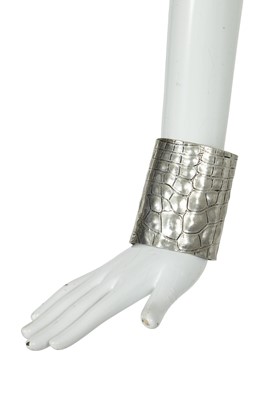Lot 212 - An Yves Saint Laurent crocodile-embossed silver-tone cuff, 2000s