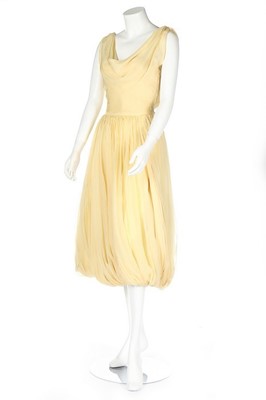 Lot 211 - A Maggy Rouff couture primrose chiffon...