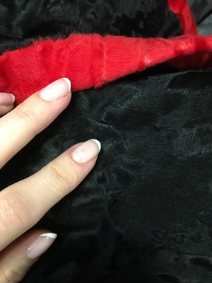 Lot 464 - A Hubert de Givenchy haute couture black and red breitschwanz jacket, 1980s