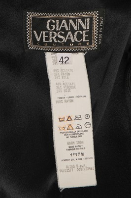 Lot 294 - A Gianni Versace black rayon cut-out evening gown, Spring-Summer 1994