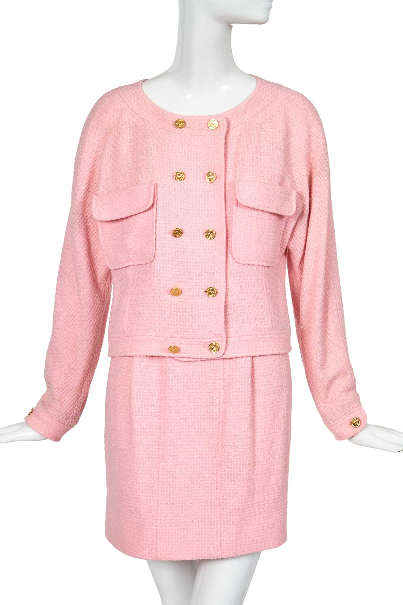 Lot 49 - A Chanel by Karl Lagerfeld pink bouclé suit, circa 1987-88