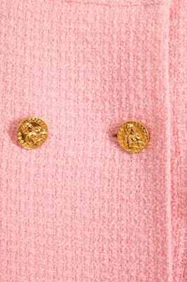 Lot 49 - A Chanel by Karl Lagerfeld pink bouclé suit, circa 1987-88